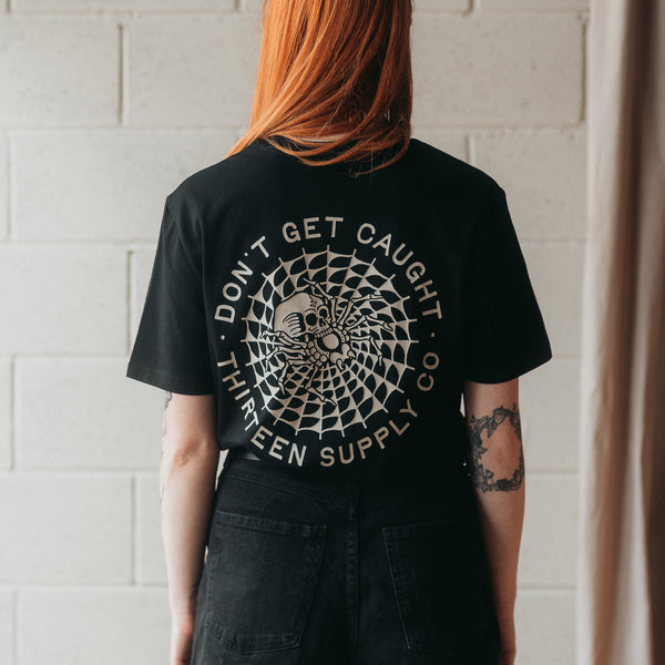 DON'T GET CAUGHT - BLACK UNISEX T-SHIRT